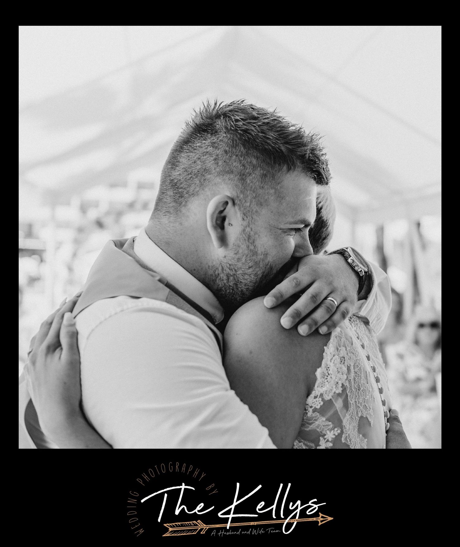 Intimate black and white portrait of newlyweds embracing in an emotional moment.