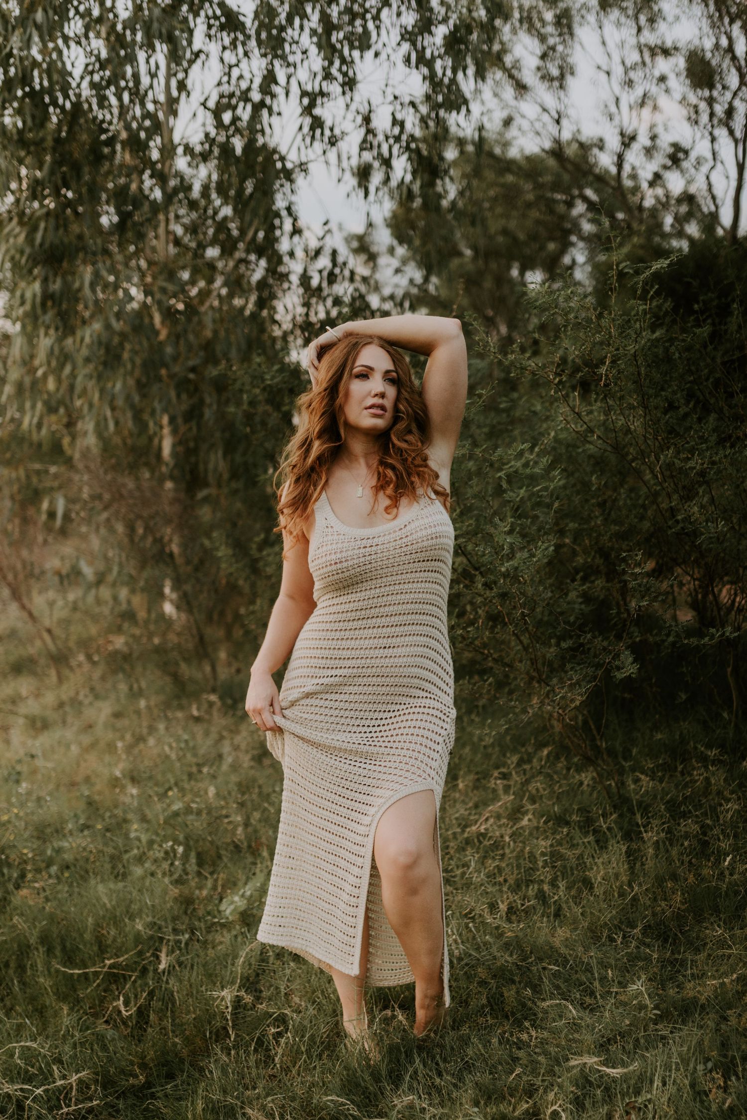 Woman standing amongst greenery at Lake Moondarra, Mount Isa