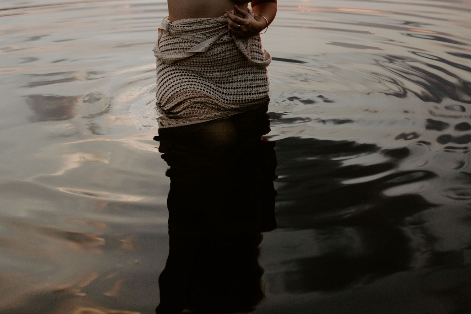Woman standing in water at Lake Moondarra, Mount Isa