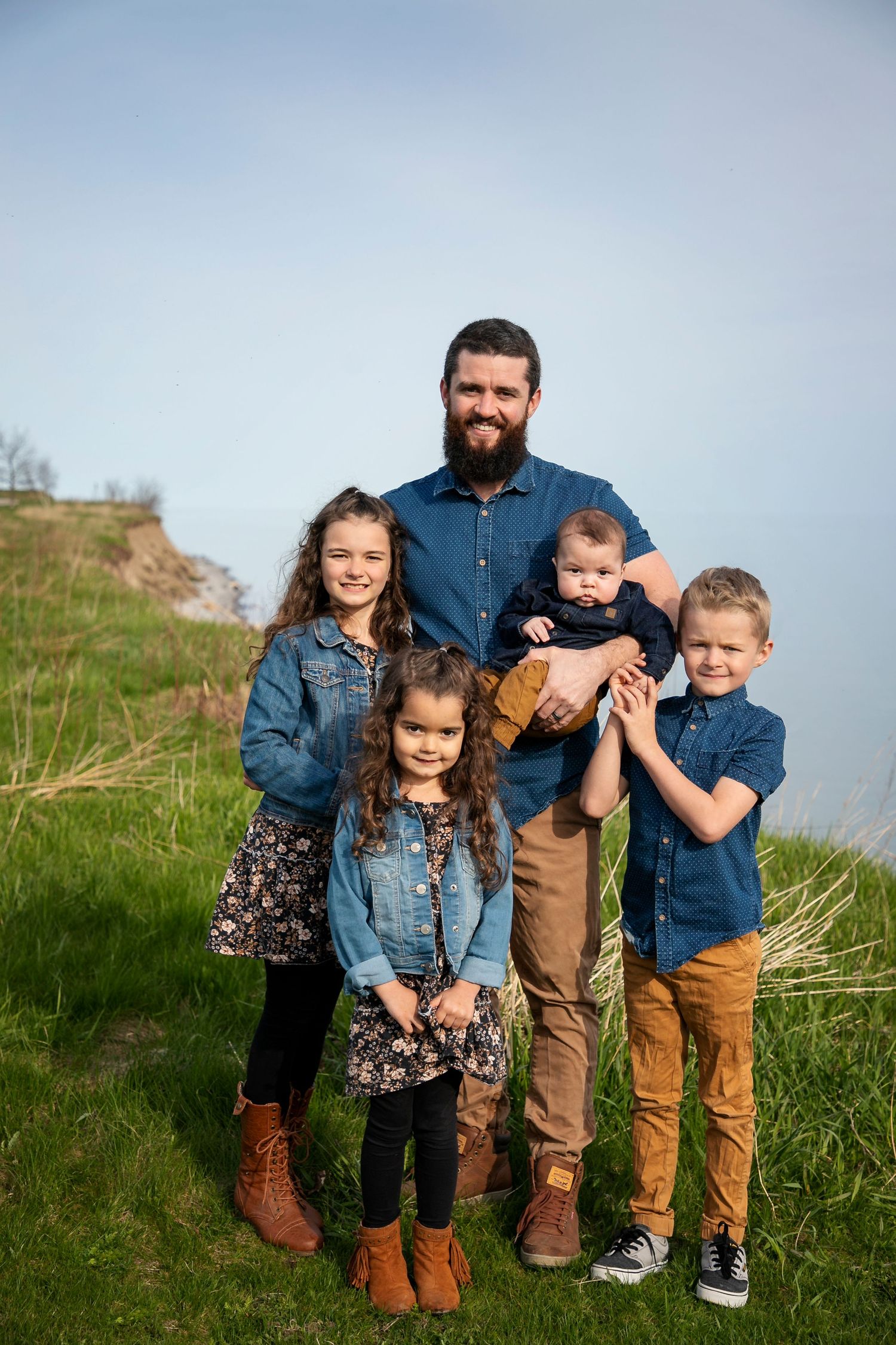 A dad and his 4 kids at the Samuel wilmot nature area in Newcastle, ON