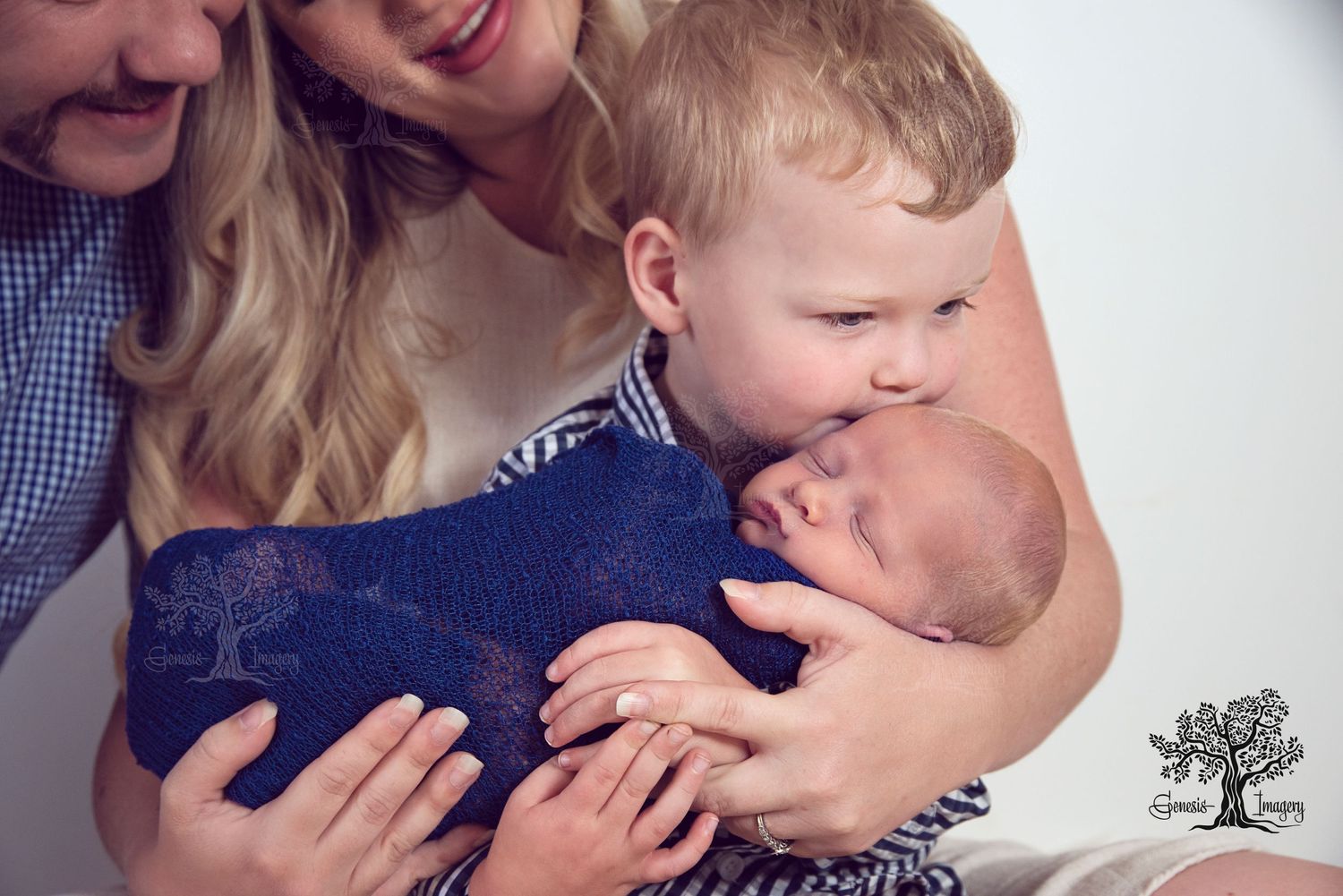 First-time parents with newborn baby in a luxury Gold Coast photography studio.