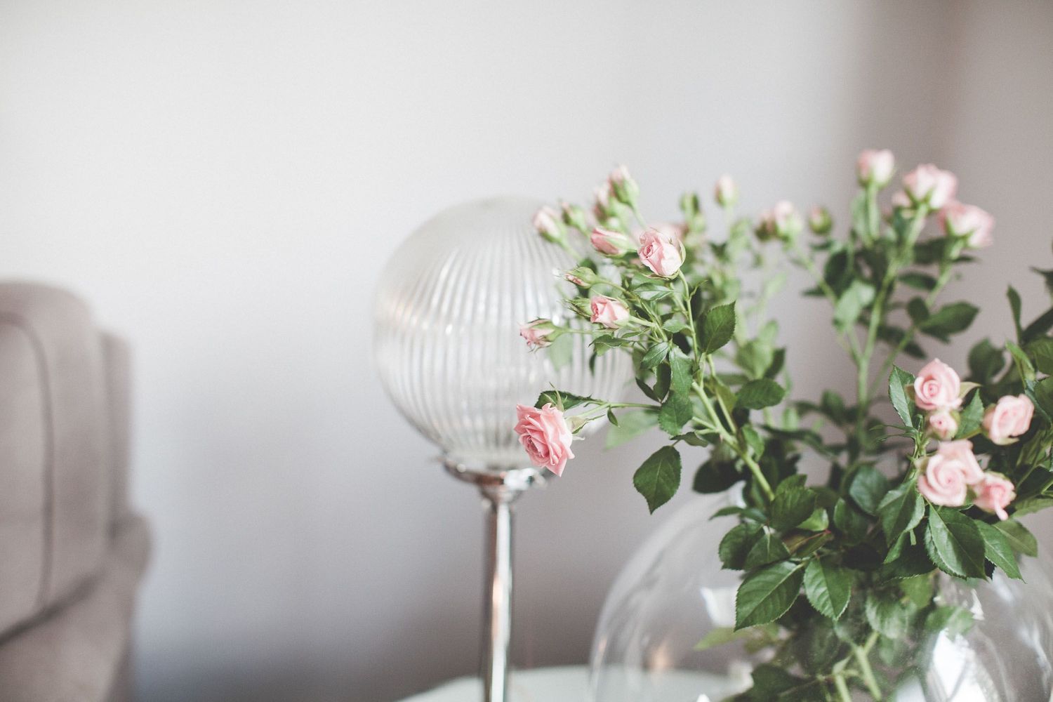 pink roses in a clear vase, interior shot