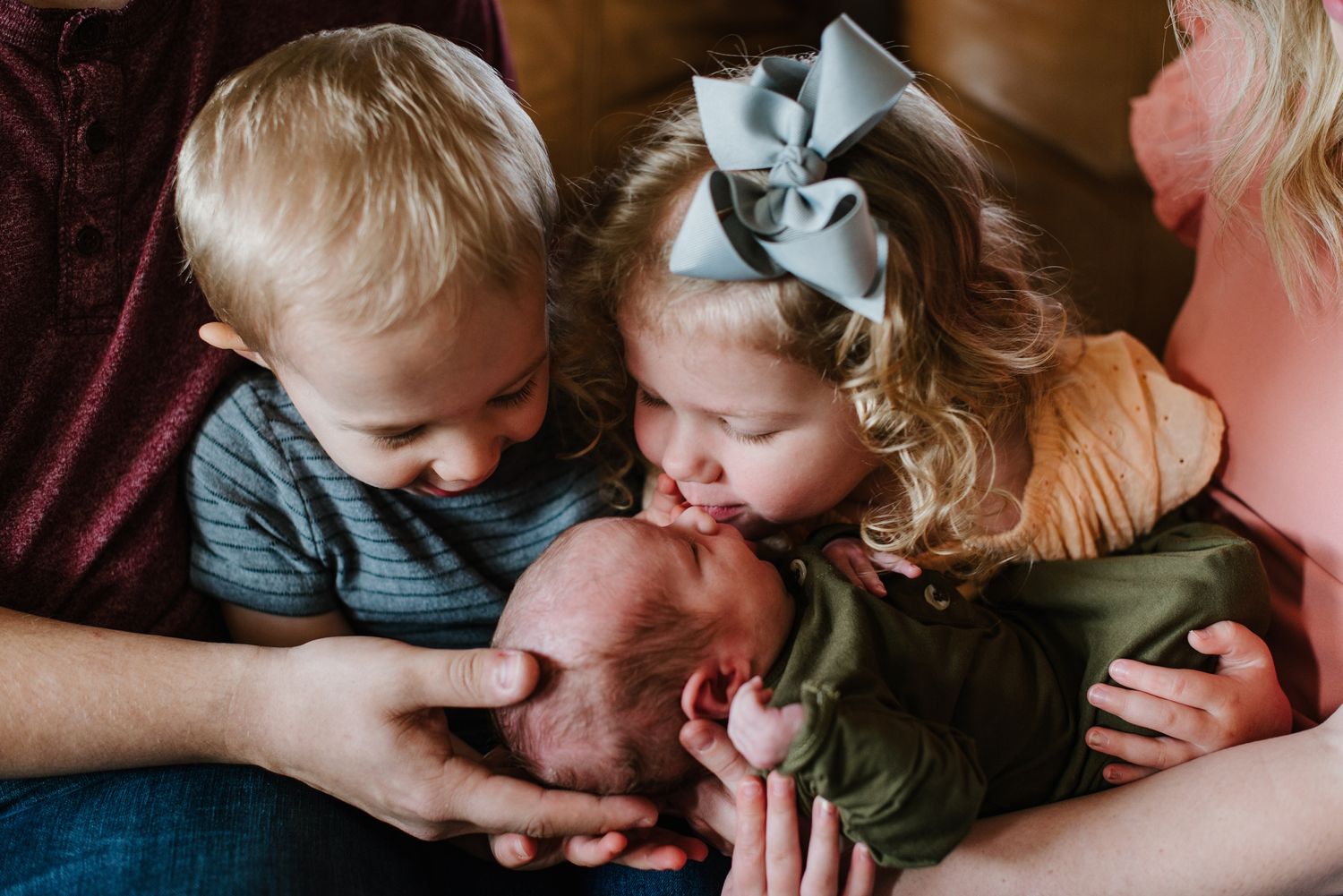 In-home lifestyle newborn family photo session by Wichita photographer