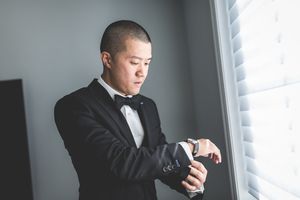 Weddings Captured By Ivan - Groom checking time