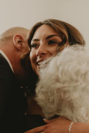 Intimate wedding moment captured in warm tones with gentle smiles.