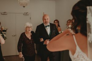 Wedding ceremony image shows interactions with guests in an intimate indoor setting.