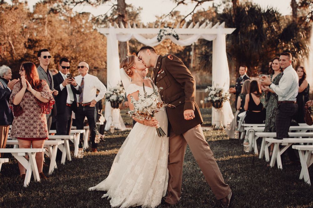 A joyful wedding ceremony exit with the newlyweds walking down the aisle.