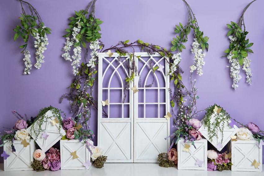 Purple backdrop with white gothic doors and hanging wisteria flowers for photography.