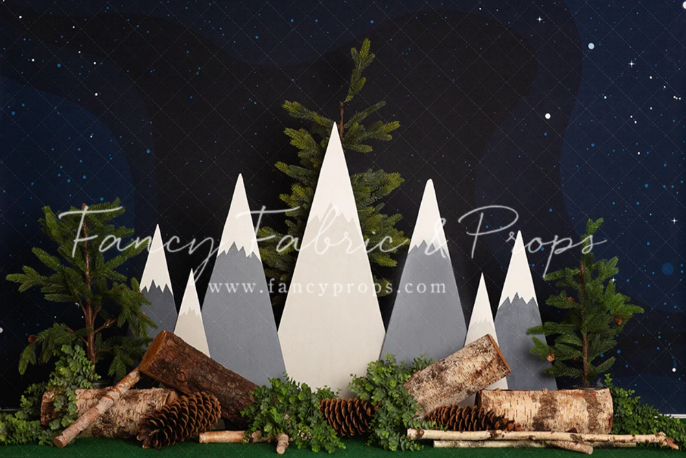 Modern geometric mountain scene with pine trees against starry night backdrop.