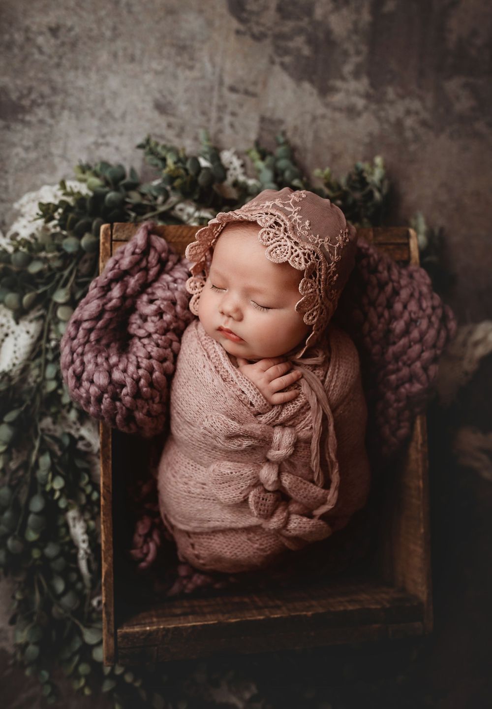 newborn session in Centralia, IL studio session, baby girl, foliage, wrapped