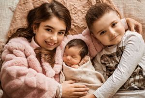 Cozy family portrait series showing intimate moments in warm tones.