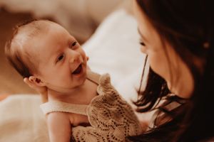 Intimate family portrait showing gentle interactions in warm lighting.