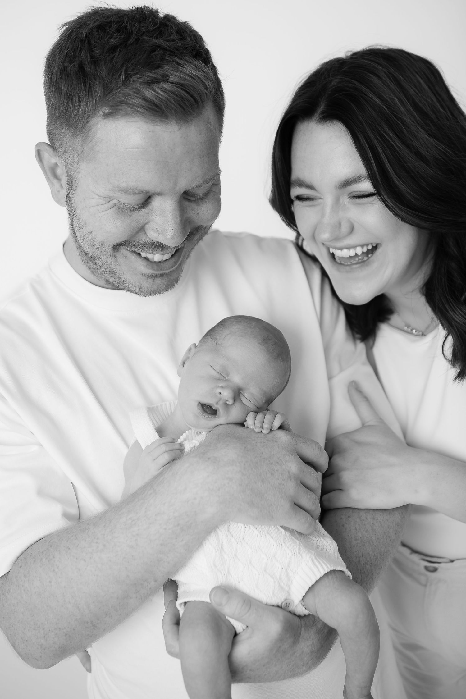 A tender black and white portrait capturing a joyful moment.