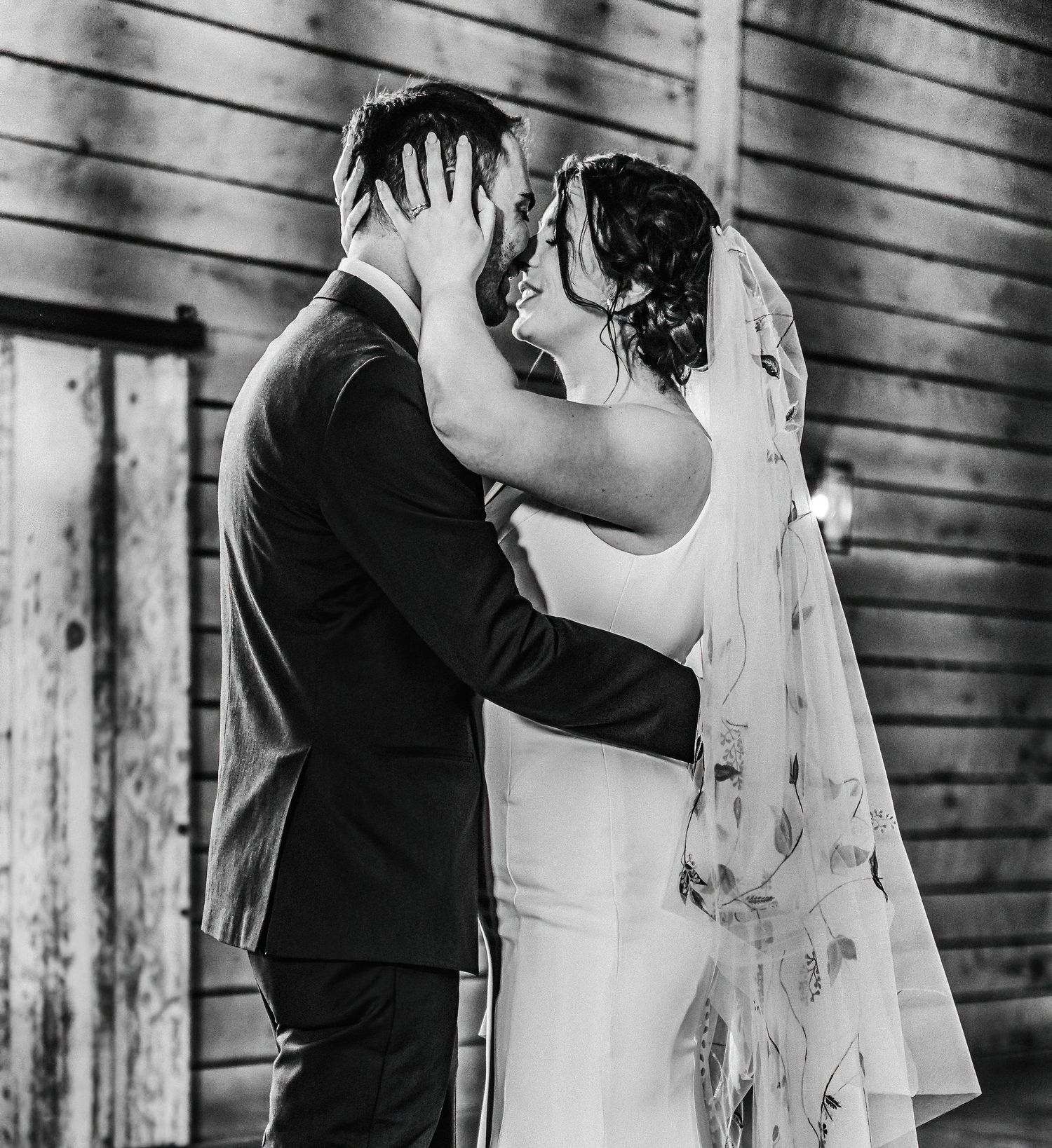 The happy couple embraces during their first dance as a married couple during their reception.