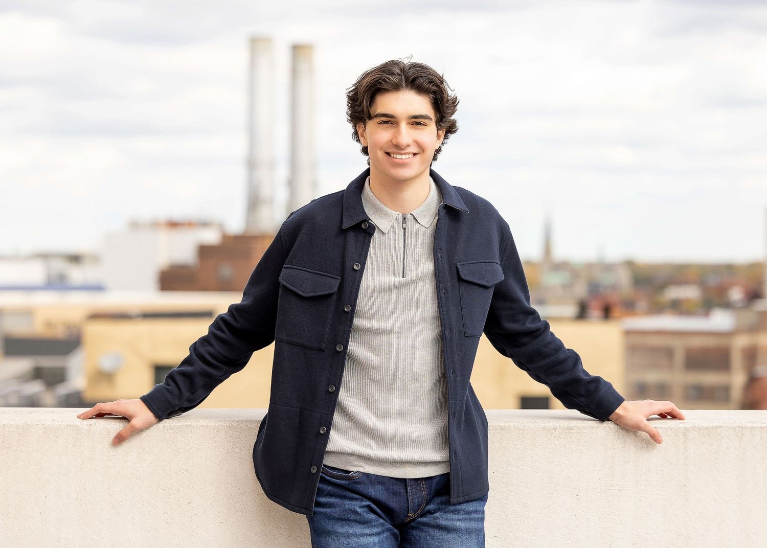 Senior photography standing on top of building. Beverly Hills, MI