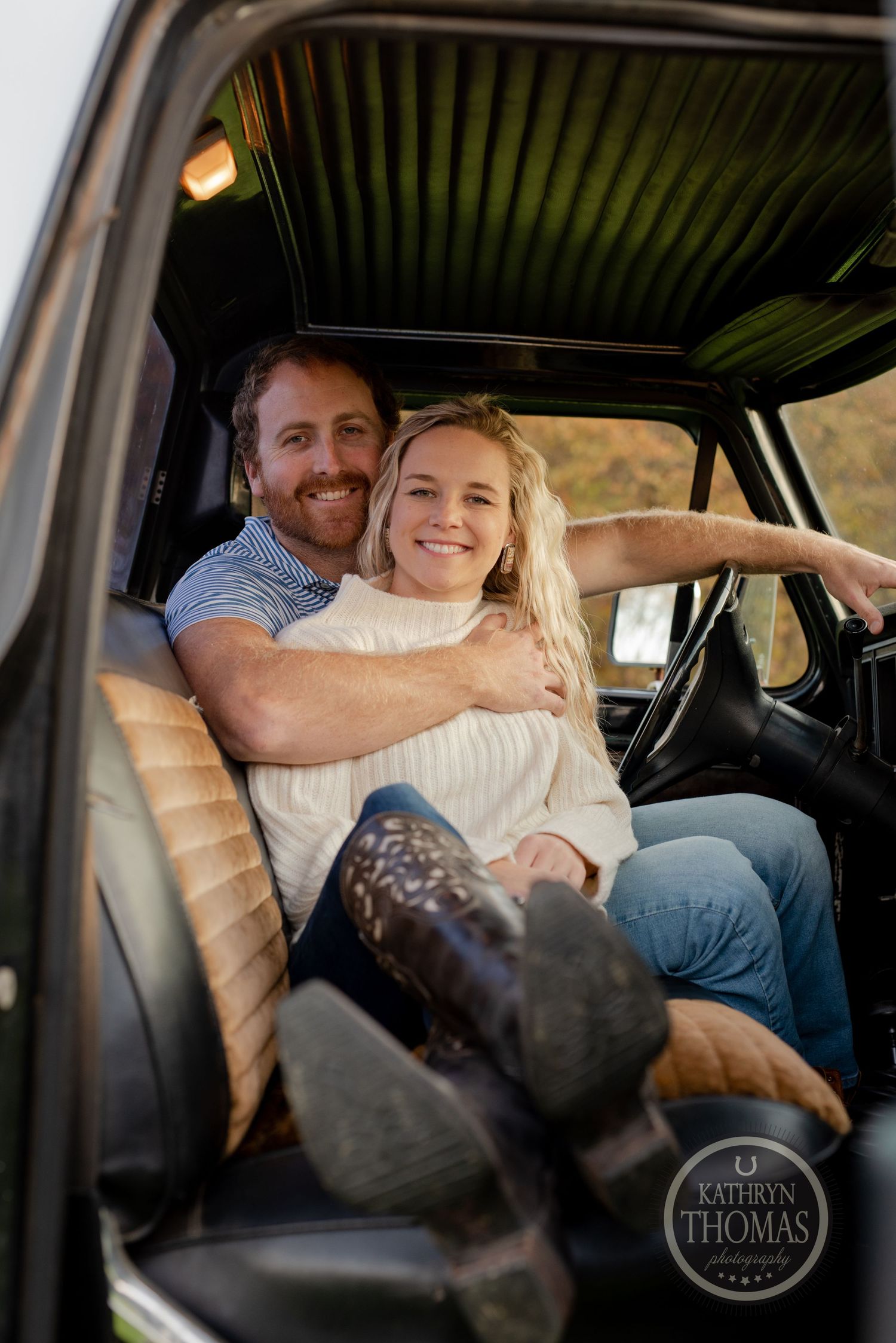 Intimate moment captured inside a classic truck cab with leather seats and retro interior.