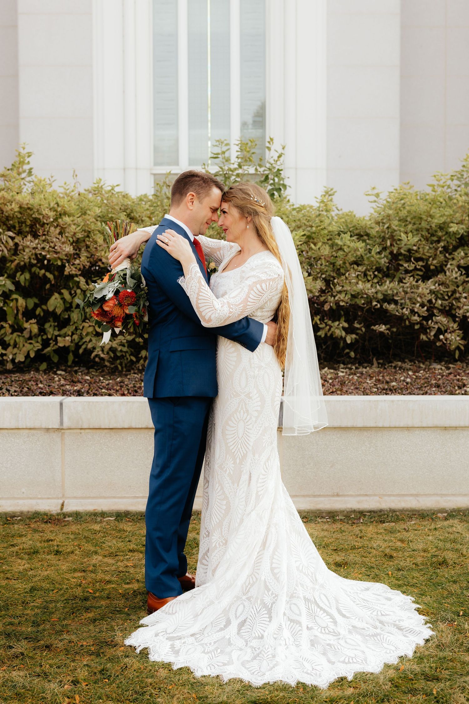 Wedding Couple standing together embracing