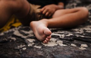 Detail photo of a child barefoot by Kristy Baker Photography, a local Steamboat Springs, Colorado photographer.