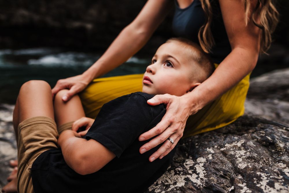 Photo of a boy embraced by his mother by Kristy Baker Photography, a local Steamboat Springs, Colorado photographer.
