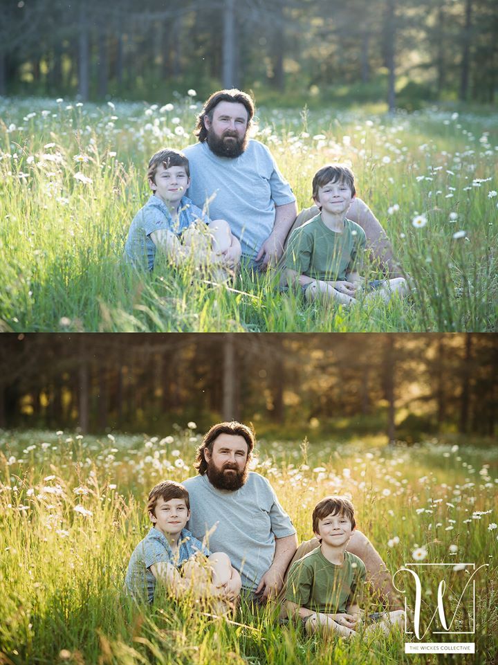 Three individuals sitting in a sunlit meadow filled with white flowers.