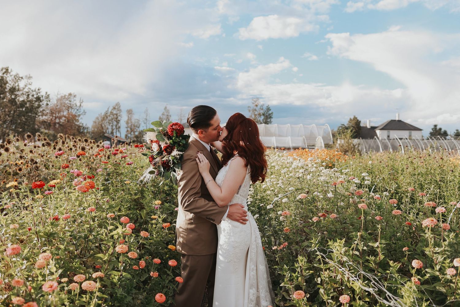 A romantic moment shared in a wildflower field filled with colorful blooms.