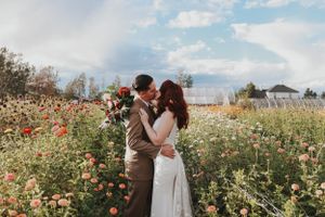 A romantic moment shared in a wildflower field filled with colorful blooms.