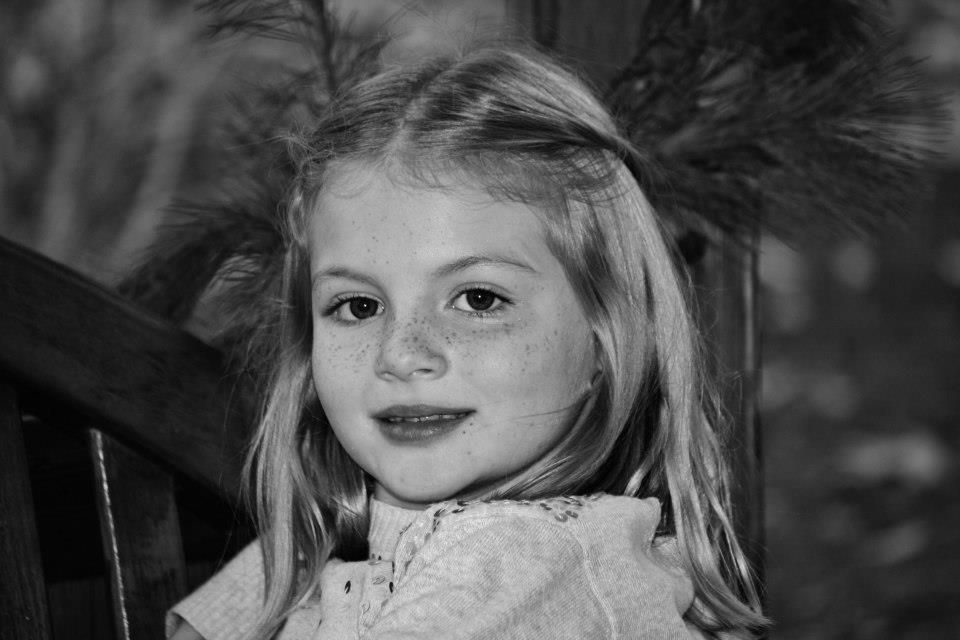Black and white portrait series showing different expressions and angles.