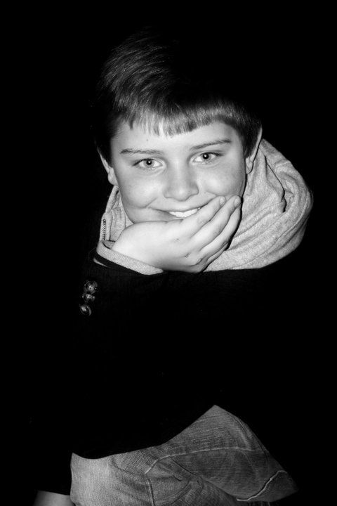 Artistic black and white close-up portraits against a dark background.