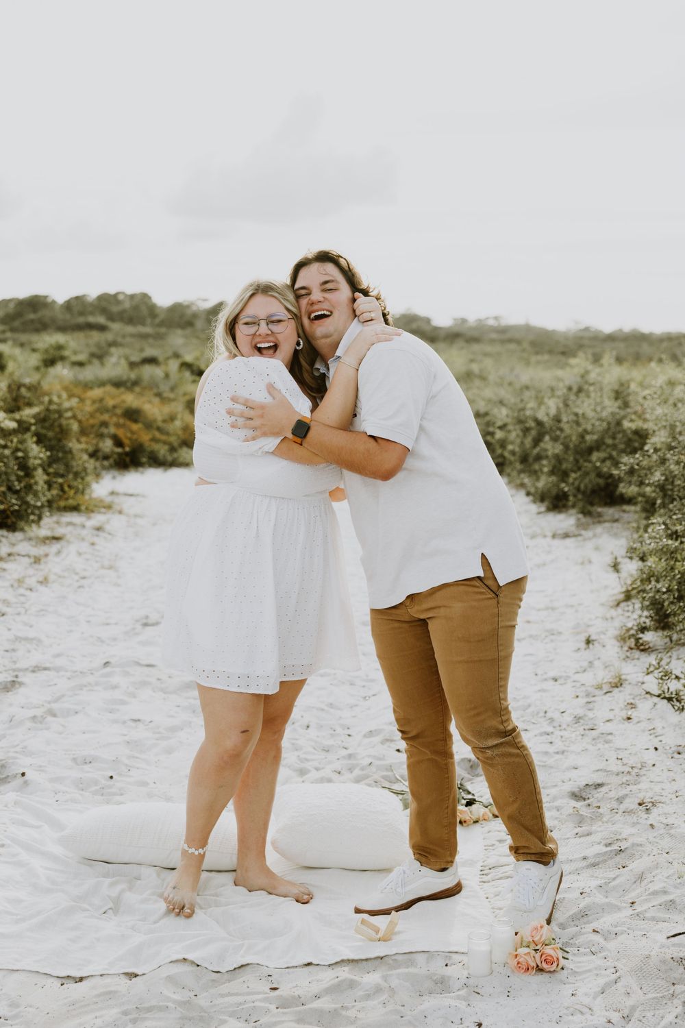 Golden hour proposal photos of a couple on the nature trail and dunes of Juno Beach, Florida captured by Lindsay McDow Photography