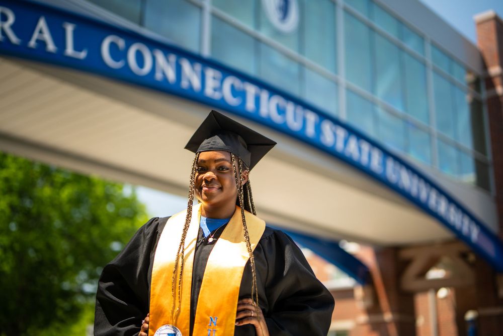 woman in suit posing at graduation — portrait by Timoy B Photography in Connecticut