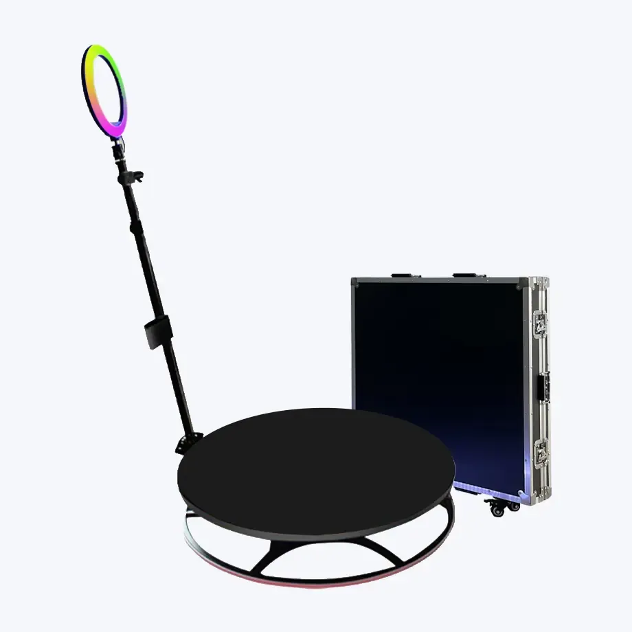 Professional 360-degree photo booth setup with LED ring light and black platform.