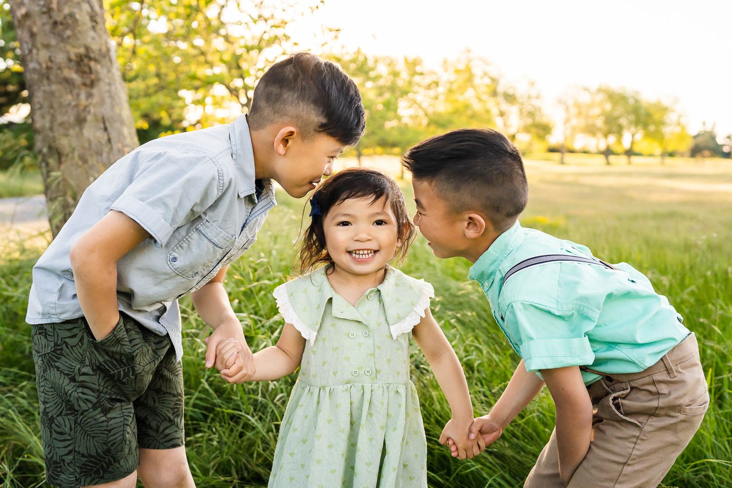 Siblings whispering secrets to each other in Seattle