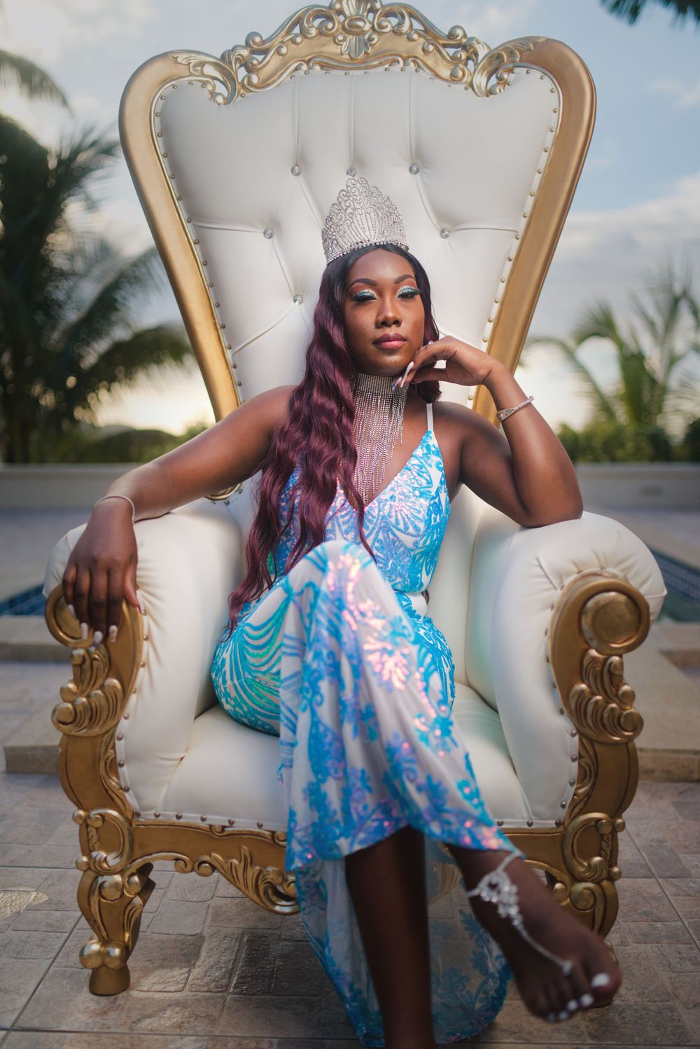 Queen sitting on white and gold throne taken by yonnie j's photo media events in Antigua and Barbuda at Avec Amour inc