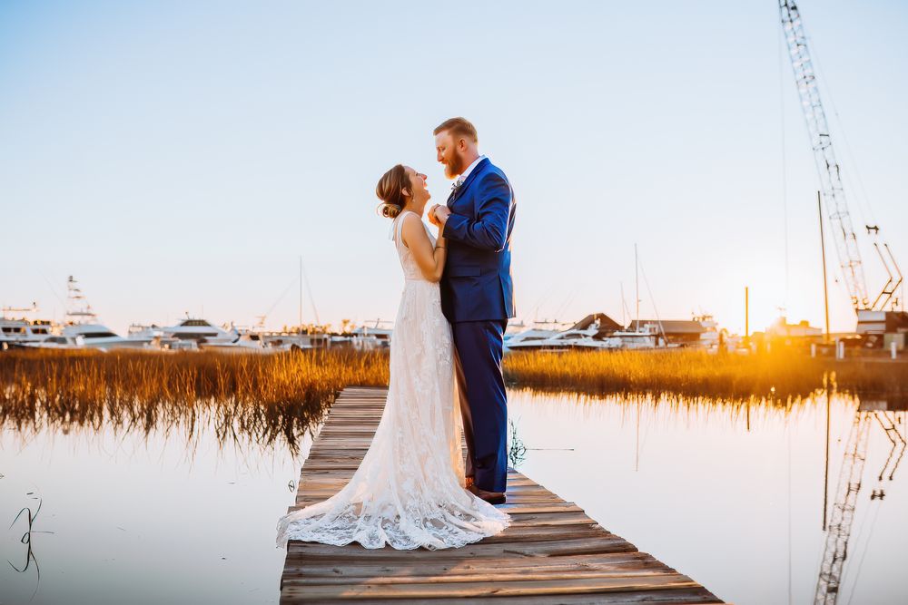 couple on marsh at sunset