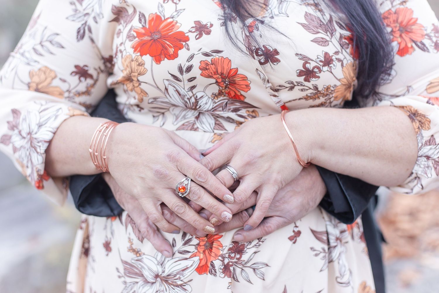 Engagement photos featuring floral dress details and intimate poses.