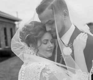 Black and white romantic wedding portraits captured in soft, intimate moments.