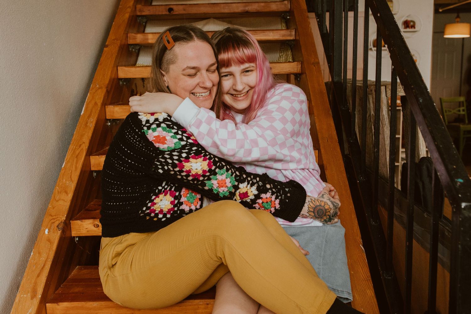 kimberly with oldest child on stairs queer family photographer portland oregon