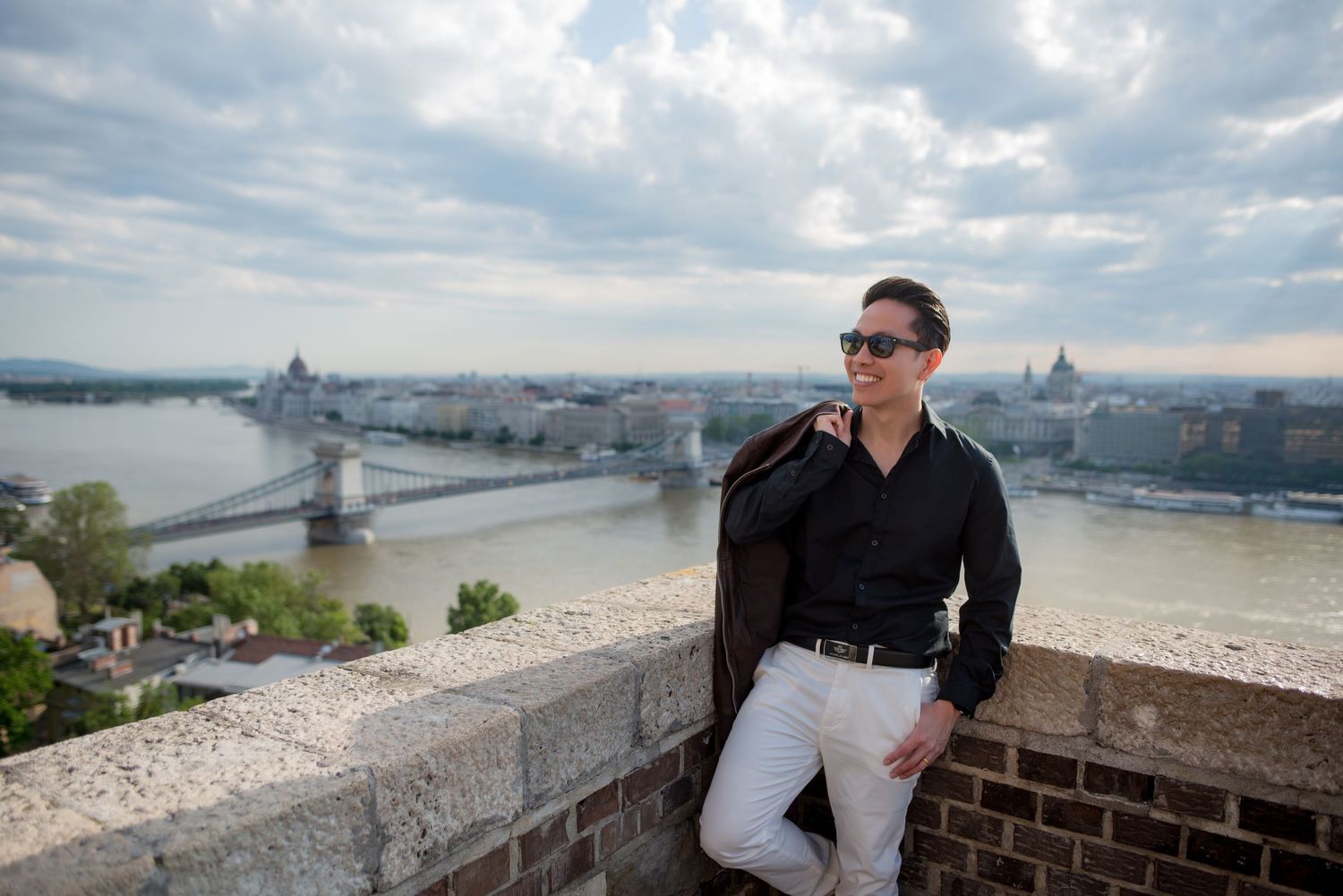 solo traveler posing for a photo shoot with his budapest photographer in buda castle