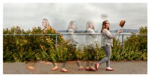 An image with multiple images of the same woman throwing and catching her hat at Jack Block Park, West Seattle.