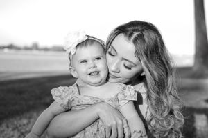Beautiful black and white photos capturing loving interactions between parent and child.