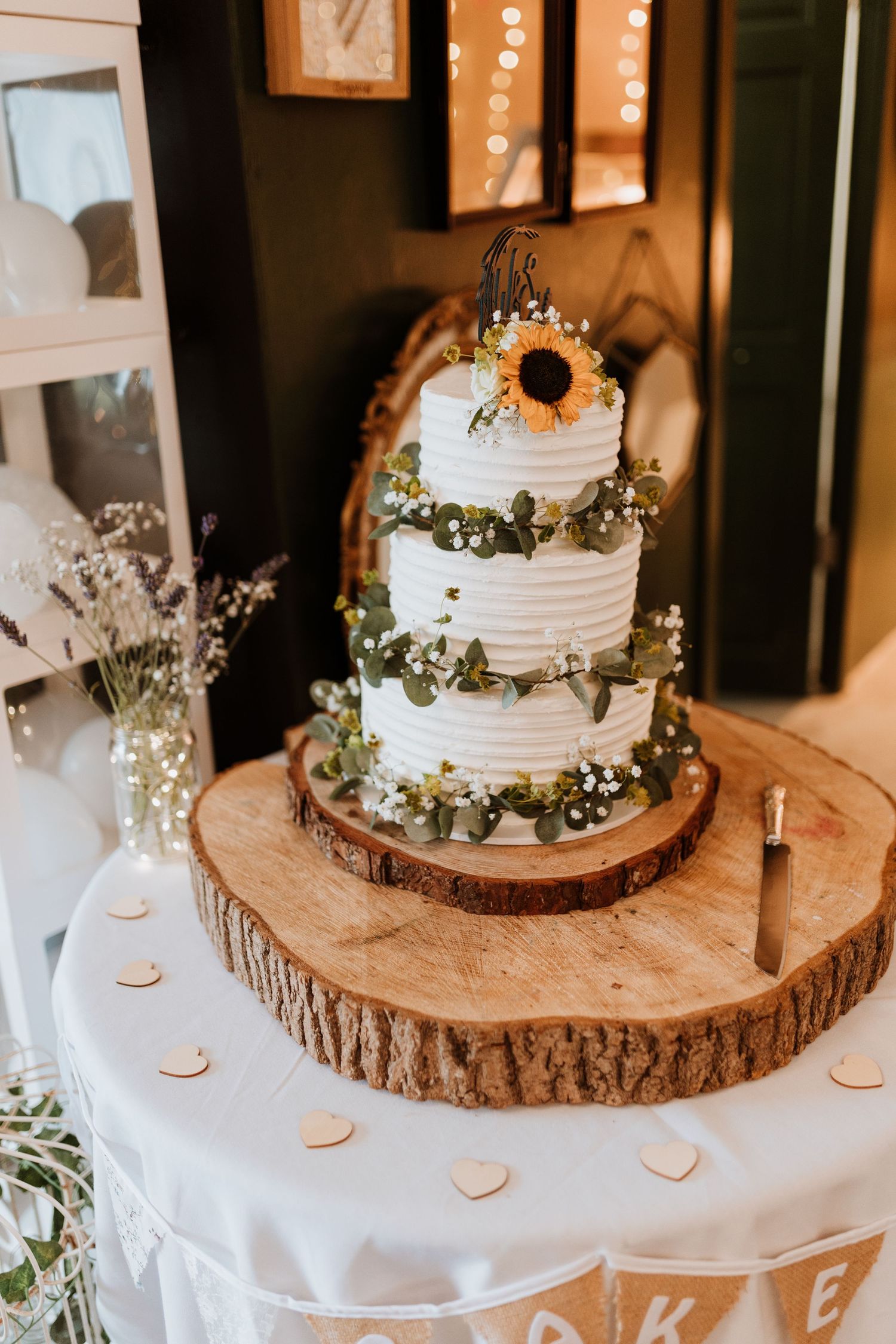 beautiful 3 tiered rustic wedding cake with sunflowers