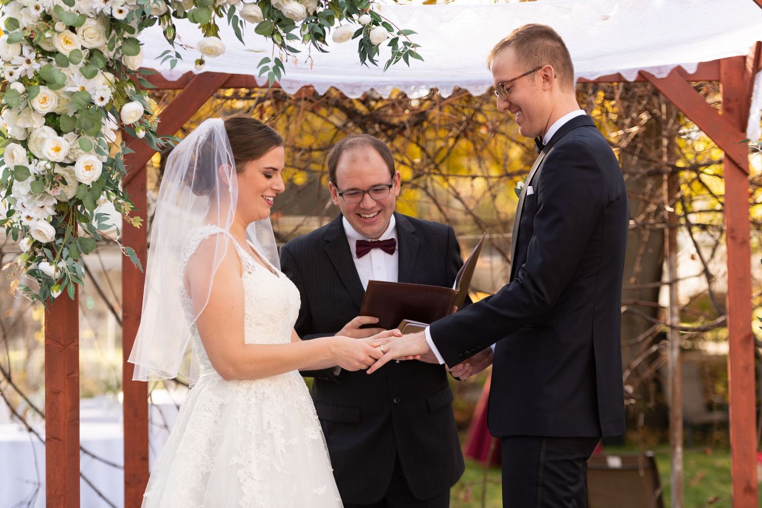 Bride and Groom exchange vows in their backyard wedding ceremony Newton MA Leah Ramuglia Photography