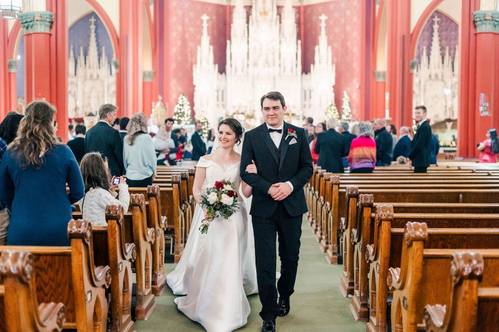 Bride and groom walk down the aisle after their wedding mass at Holy Family Cathedral in Tulsa, Ok.