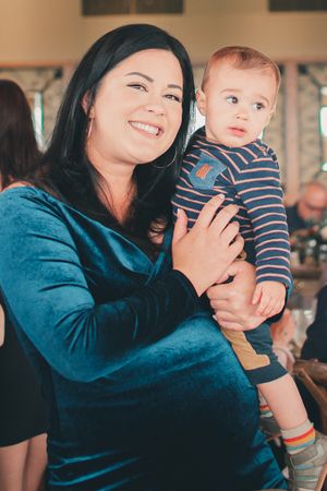 A tender moment captured indoors with warm lighting and comfortable atmosphere.