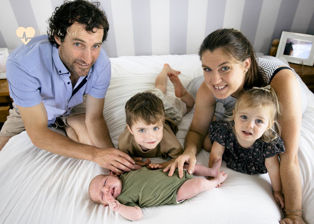 lady and man with two kids and baby