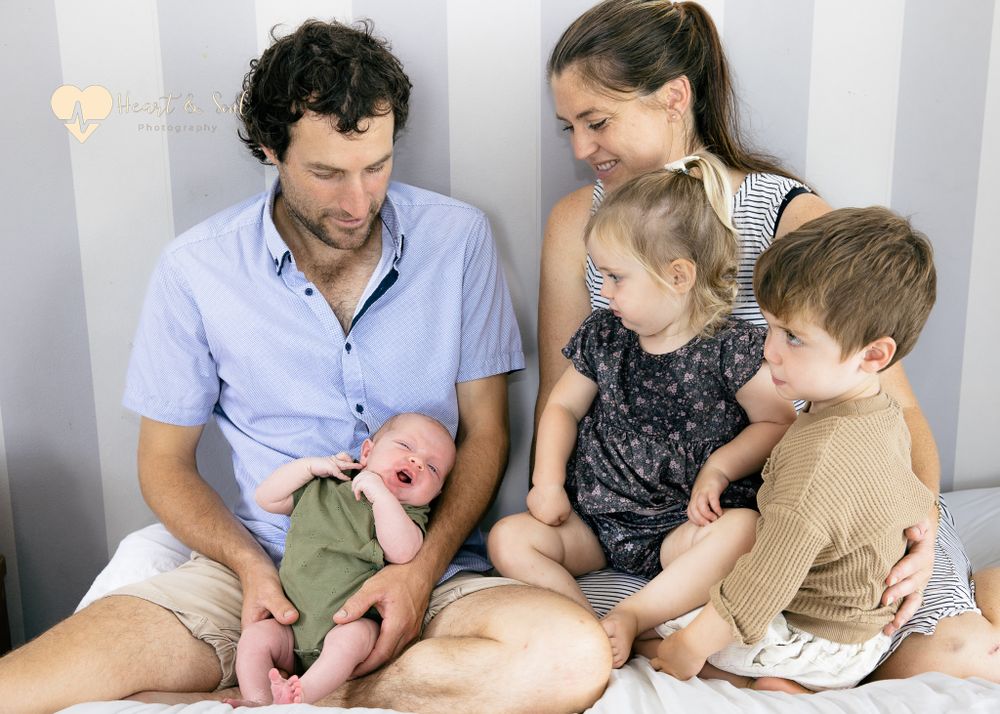 lady and man with two kids and baby