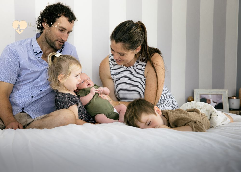 lady and man with two kids and a baby
