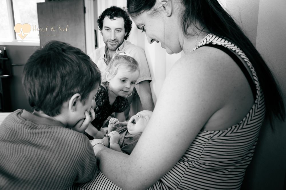 black and white photo of lifestyle newborn family photo