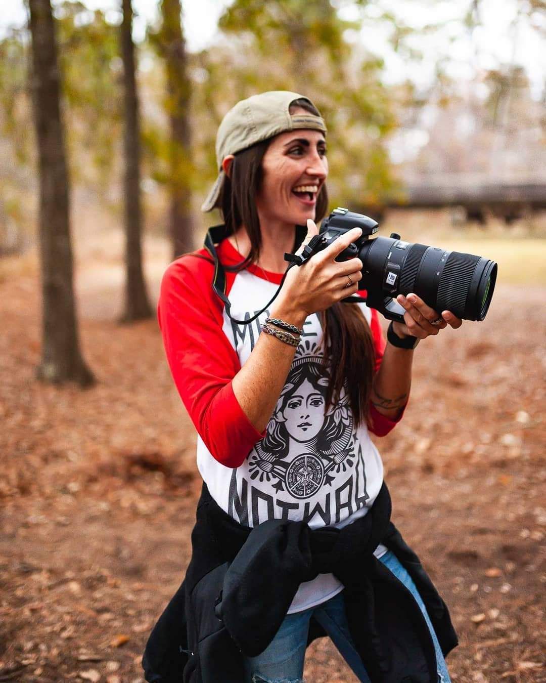 owner of JEM Photography holding camera