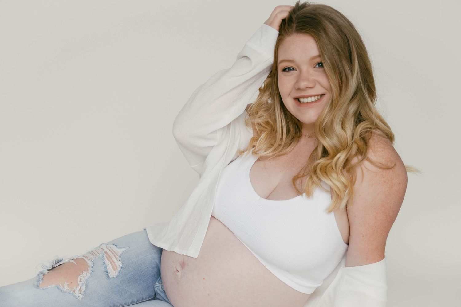 Playful lifestyle photoshoot showing joyful moments against a white background.